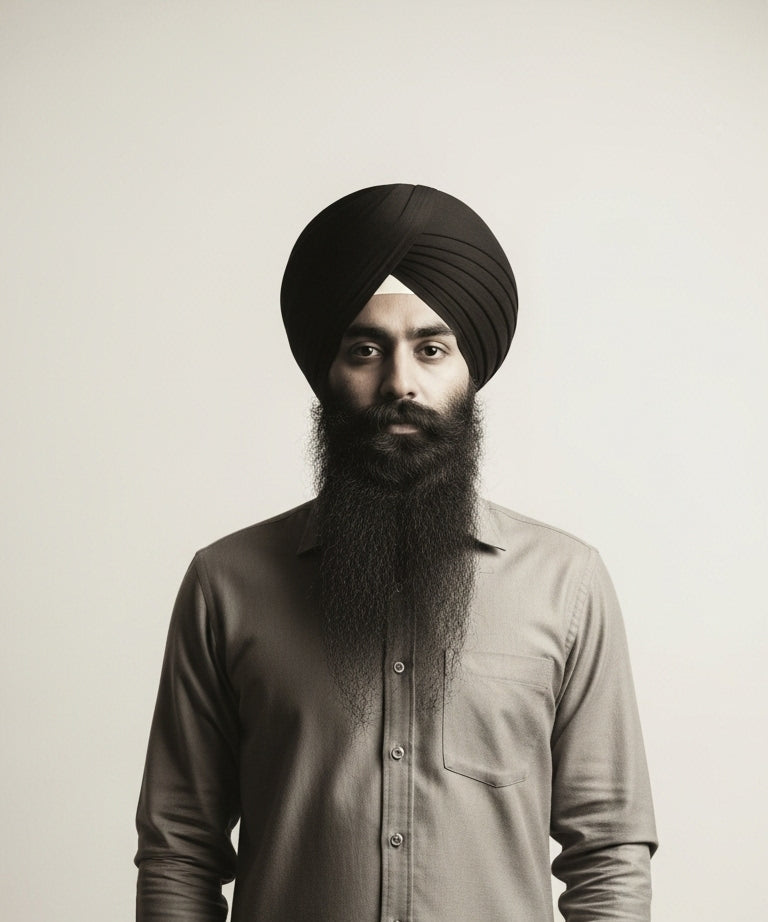 men standing straight and he ties black turban and whole seen is black and white 