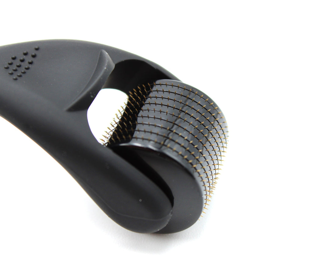 Black derma roller on a white background
