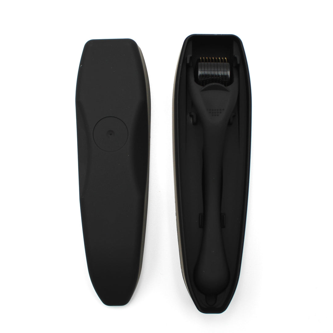 Black grooming derma roller on a white background