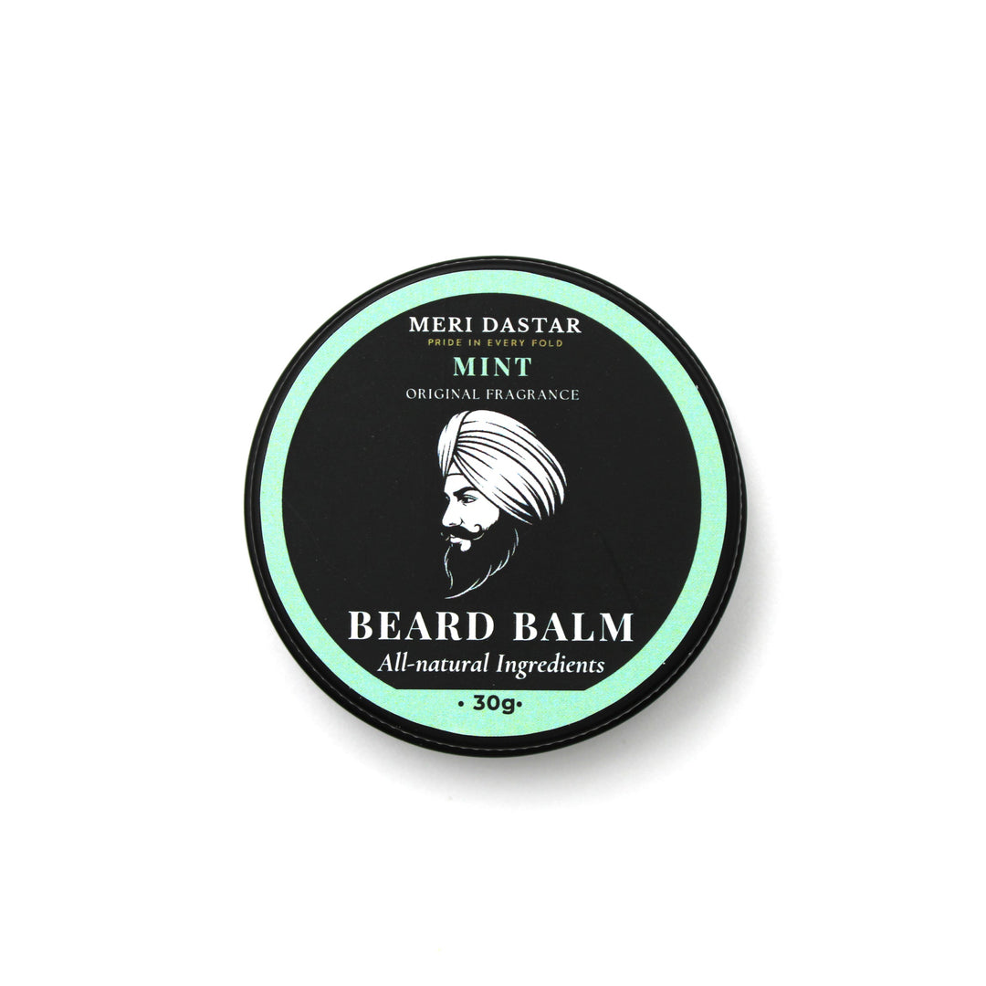 Beard balm container with green and black design on a white background