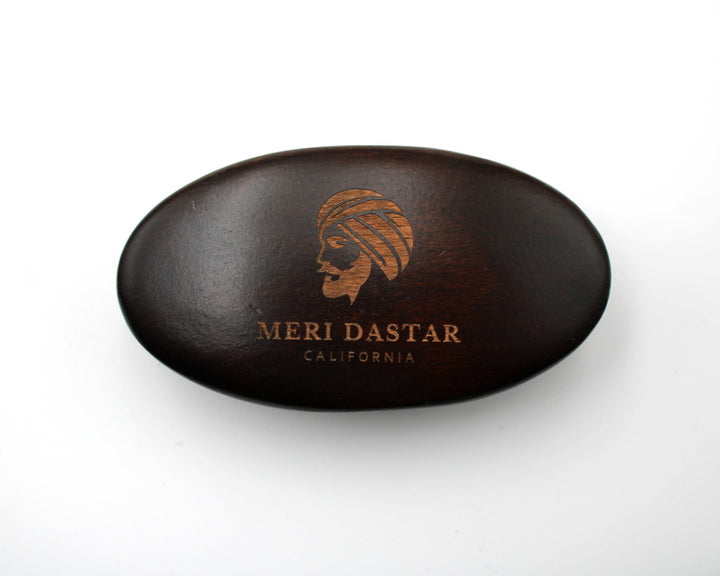 Brown beard brush 'Meri Dastar California' branding on a white background