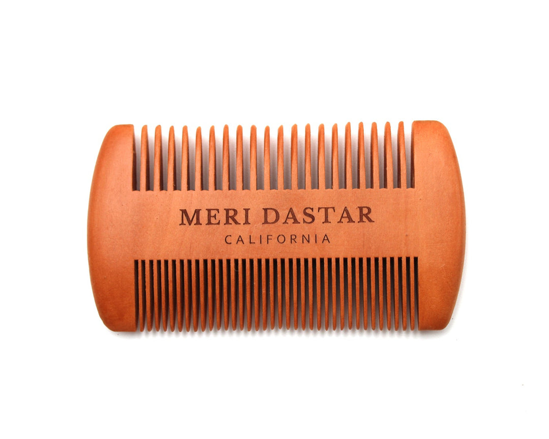 Wooden comb with 'Meri Dastar California' branding on a white background