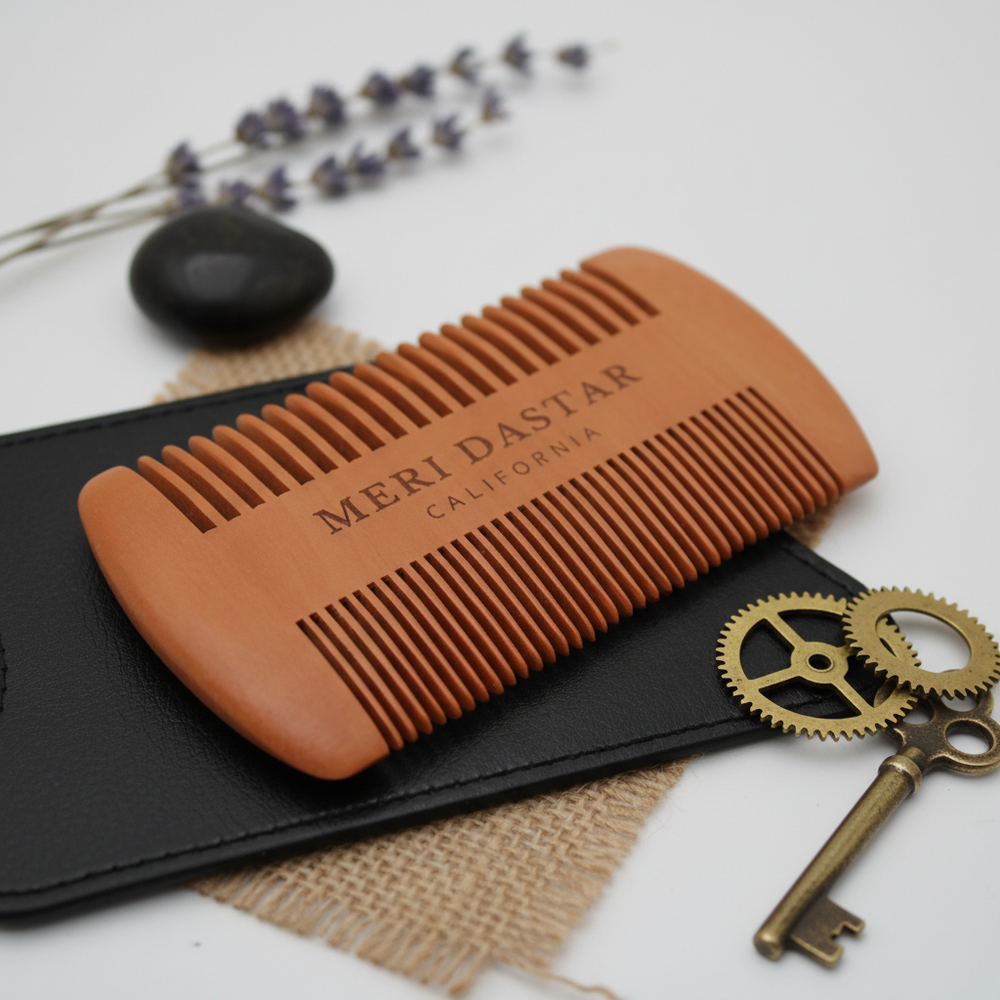 Orange Meri Dastar comb with black case on a white background
